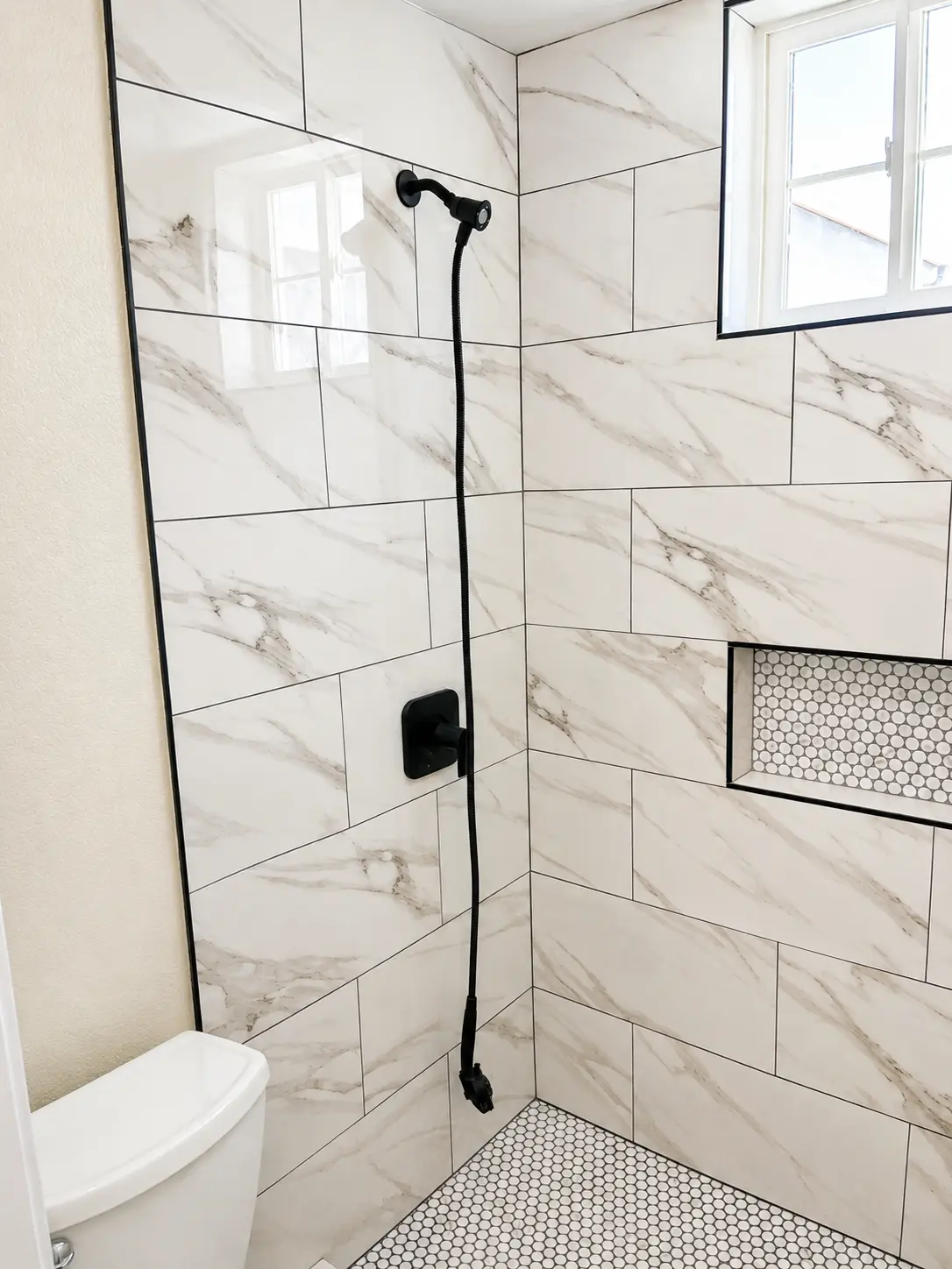 Marble & Matte Black Shower — Bathroom Remodels by Arnold Barrera Construction